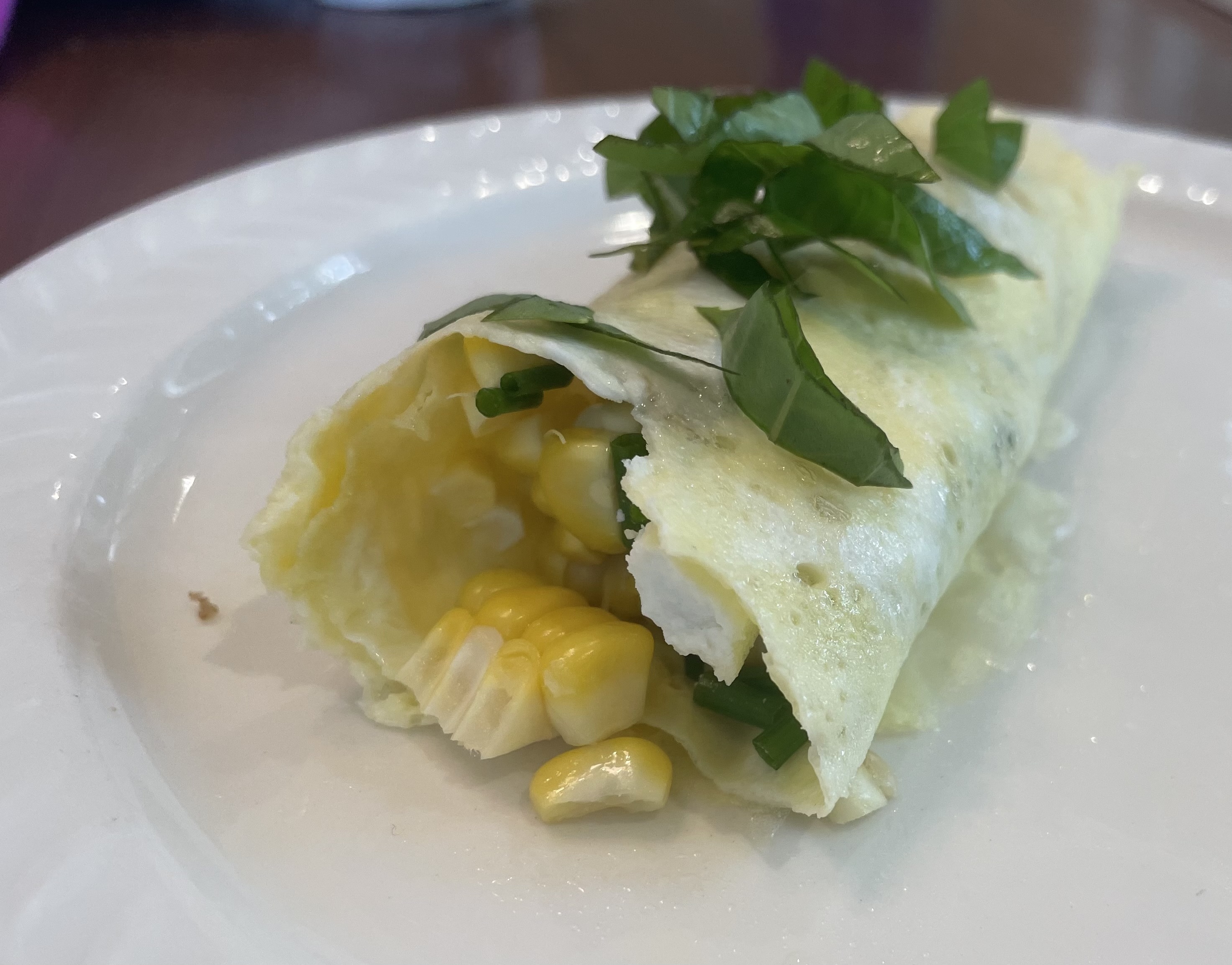 Egg wrapper with fresh corn and cheese
