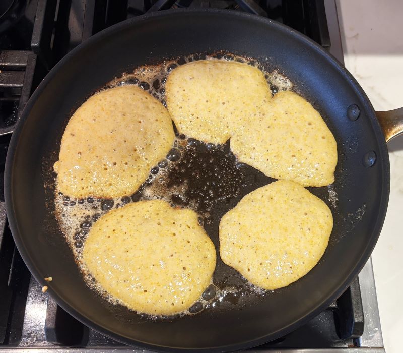 Honey cornbread pancakes cooked in butter